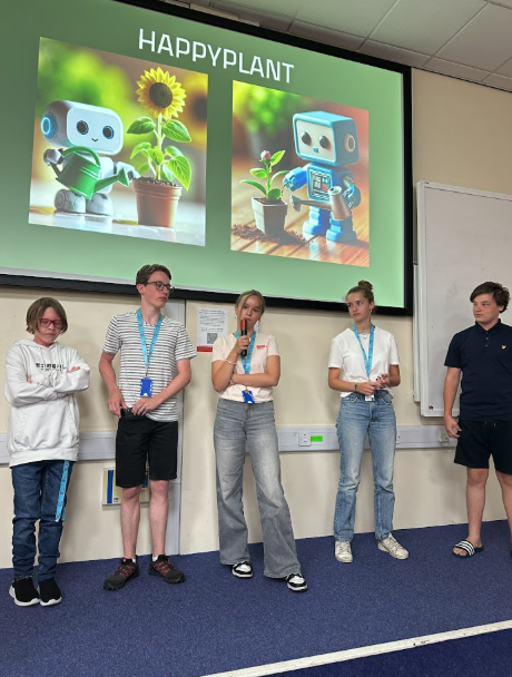Team pitching HappyPlant startup with presentation slides